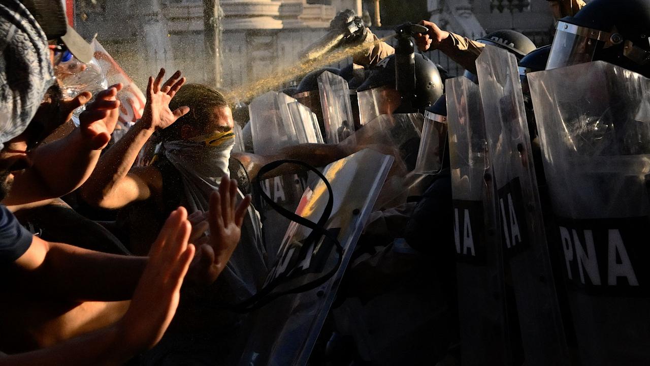 Demonstrators clash with police outside Congress in Buenos Aires during the debate of the “omnibus bill,” which proposes major changes to Argentina’s economy. Picture: Luis Robayo/AFP