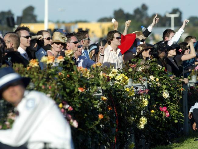 Security keep an eye on the crowd at Flemington on Derby Day.