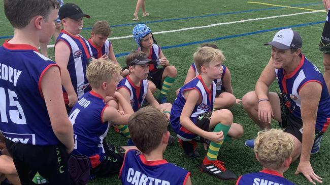 Sam McMahon (right) coaching in Singapore. Picture: Supplied