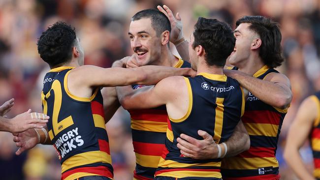 ADELAIDE, AUSTRALIA – JUNE 10: Taylor Walker of the Crows celebrates a goal with teammates during the 2023 AFL Round 13 match between the Adelaide Crows and the West Coast Eagles at Adelaide Oval on June 10, 2023 in Adelaide, Australia. (Photo by Sarah Reed/AFL Photos via Getty Images)