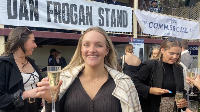 Millie Smith enjoys some bubbly at the footy. Picture: Tijana Birdjan