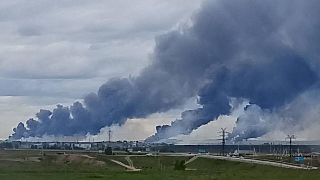 Columns of smoke rise from Russia's Belaya air base located over 4000kms from Ukraine. Drones were used to destroy Russian bomber aircraft, were hidden in truck containers. Picture: X