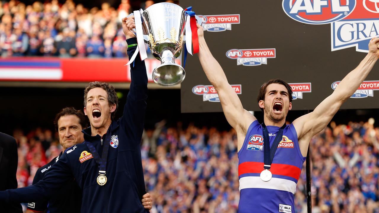 MELBOURNE, AUSTRALIA - OCTOBER 01: Robert Murphy and Easton Wood of the Bulldogs hold up the the premiership cup during the 2016 Toyota AFL Grand Final match between the Sydney Swans and the Western Bulldogs at the Melbourne Cricket Ground on October 01, 2016 in Melbourne, Australia. (Photo by Adam Trafford/AFL Media/Getty Images)