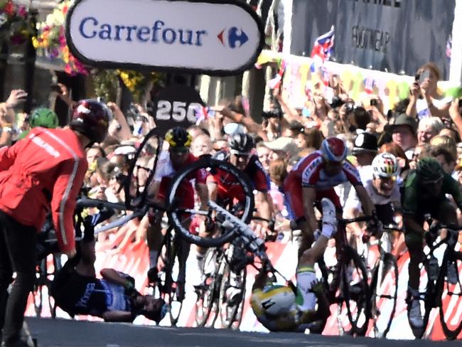 Australia's Simon Gerrans (right) and Britain's Mark Cavendish fall near the finish line at the end of the 190.5km first stage. Picture: AFP