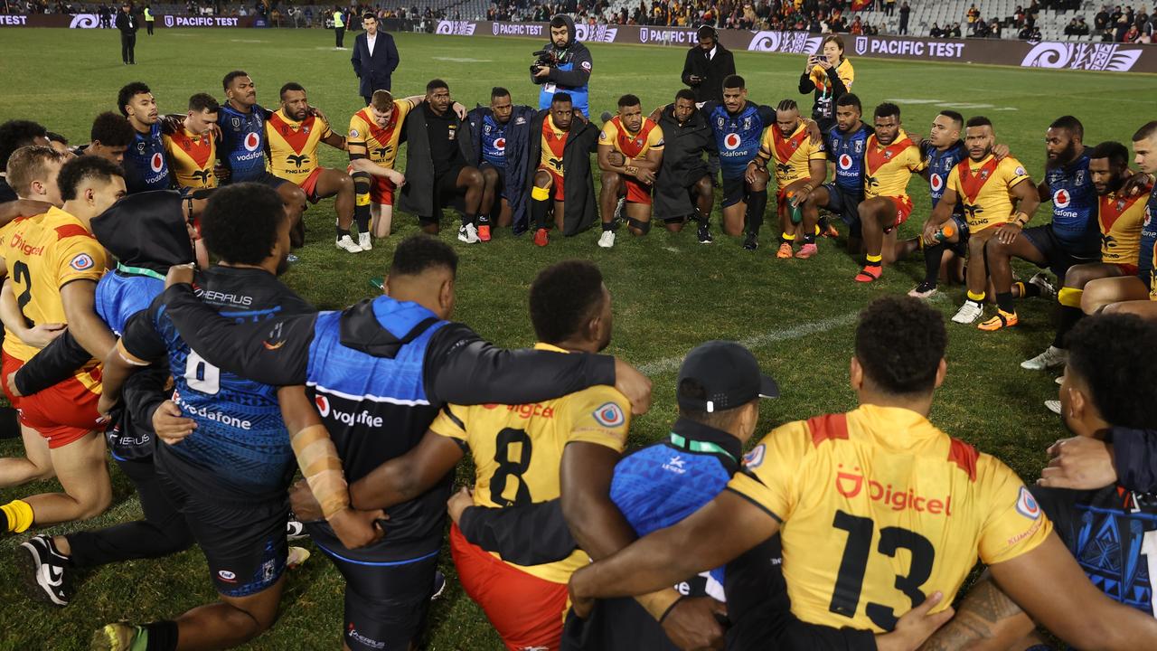 Players come together after the game between Papua New Guinea and Fiji. (Photo by Mark Kolbe/Getty Images)