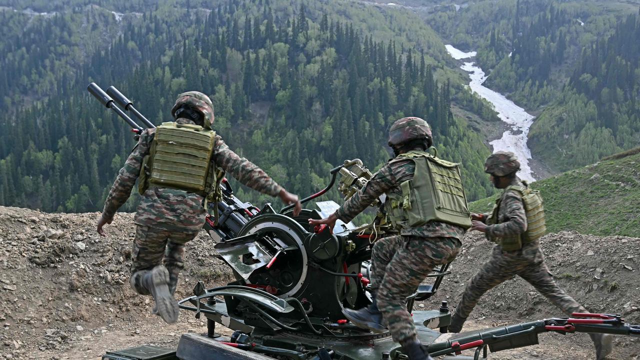 Indian army soldiers demonstrate an anti-aircraft gun near the Line of Control between Pakistan and India, in Indian-administered Kashmir. Picture: Tauseef Mustafa/AFP