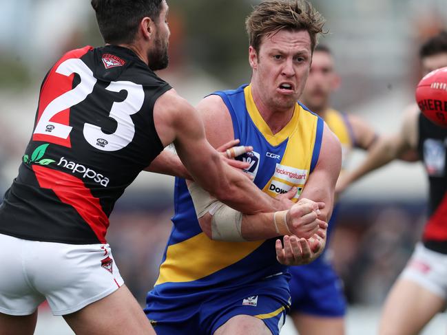 Nick Meese fires off a handball for Williamstown. Picture: Michael Klein