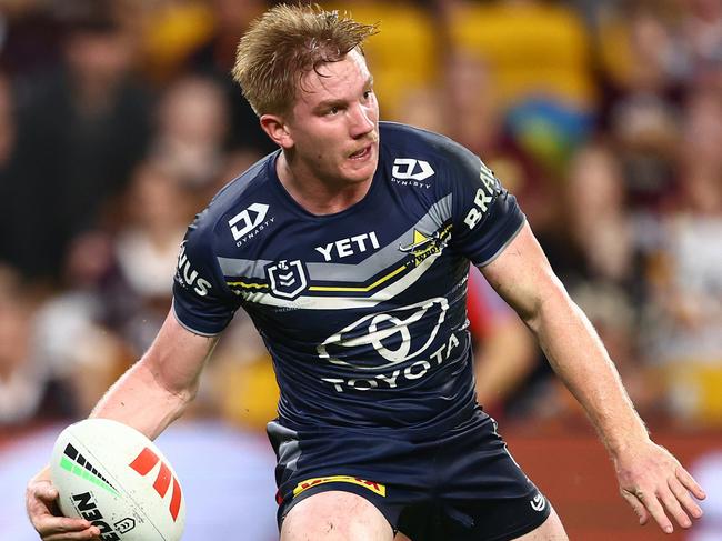 BRISBANE, AUSTRALIA - MARCH 29: Tom Dearden of the Cowboys runs the ball during the round four NRL match between Brisbane Broncos and North Queensland Cowboys at Suncorp Stadium, on March 29, 2024, in Brisbane, Australia. (Photo by Chris Hyde/Getty Images)