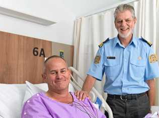 Survivor Chris Newlyn with VMR skipper Charles Linsley at Mackay Base Hospital. Picture: Emma Murray