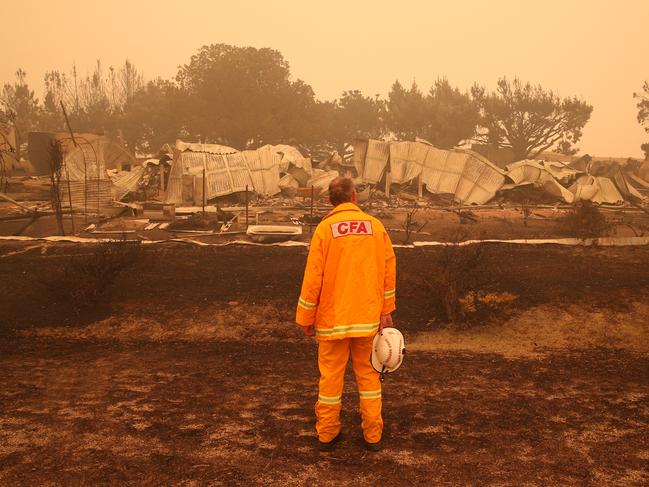 BEST PICTURES 2020. Gippsland Fires. CFA Chief officer Steve Warrington inspects the damage in Buchan after a bushfire struck the town. Friday, January 3, 2019. Picture: David Crosling/Herald Sun