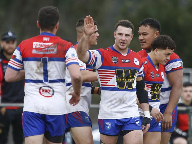 Cameron Williams prepares to high-five Emu Plains fullback Jake Bentley. Picture Warren Gannon Photography