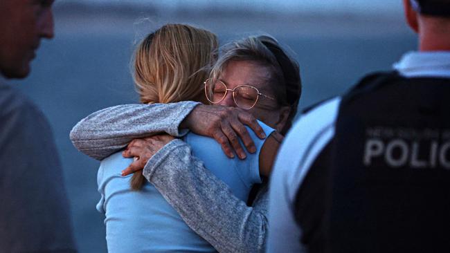 Sally Callahan, the mother of James Callahan, at a memorial at Stockton breakwall a week after his death. The avid fisherman died after being stabbed multiple times. Photographer: Adam Yip