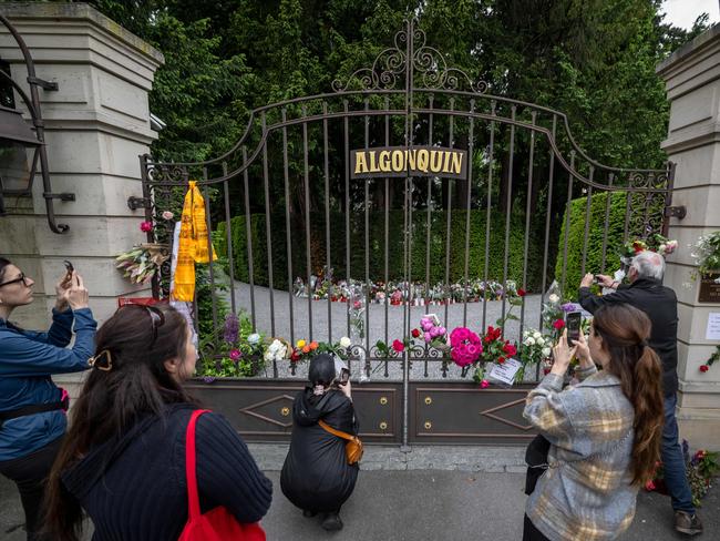 People take pictures at the entrance of the estate of late singer Tina Turner in Kusnacht. Picture: AFP