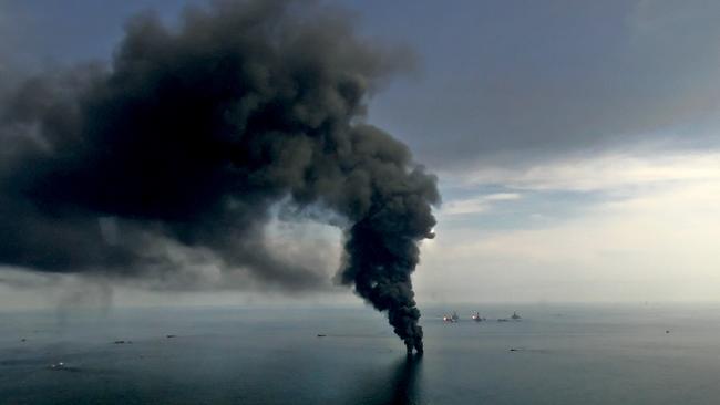 Smoke billows from controlled oil burns near the site of the BP Plc Deepwater Horizon oil spill in the Gulf of Mexico off the coast of Louisiana, U.S., on Saturday, June 19, 2010. The BP Plc oil spill, which began when the leased Transocean Deepwater Horizon oil rig exploded on April 20, is gushing as much as 60,000 barrels of oil a day into the Gulf of Mexico, the government said. Photographer: Derick E. Hingle/Bloomberg