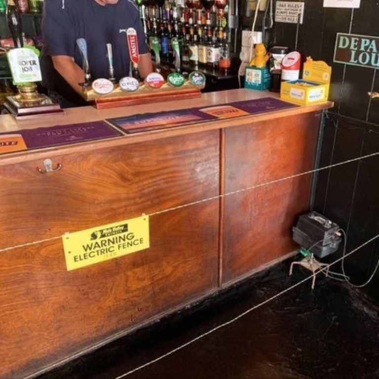 A UK pub installed an electric fence to enforce social distancing. Picture: BPM Media/australscope