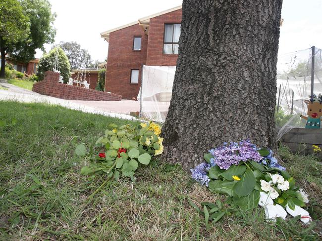 Flowers placed under a tree at the house. Picture: Andrew Tauber