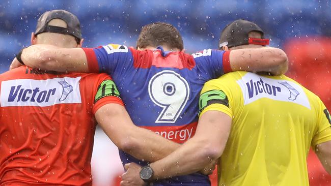 NEWCASTLE, AUSTRALIA - JULY 26: Andrew McCullough of the Knights is taken from the ground during the round 11 NRL match between the Newcastle Knights and the Canterbury Bulldogs at McDonald Jones Stadium on July 26, 2020 in Newcastle, Australia. (Photo by Mark Kolbe/Getty Images)