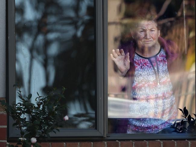 Arcare Maidstone Aged Care is has been listed as a COVID site after a resident tested positive. A resident waves from a window. Monday, May 31, 2021 Picture: David Crosling