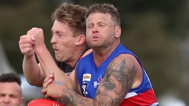 Bomber Mitchell Cleeland (left) spoils Strathmerton’s Jake Anderson in last year’s Grand Final. Picture Yuri Kouzmin