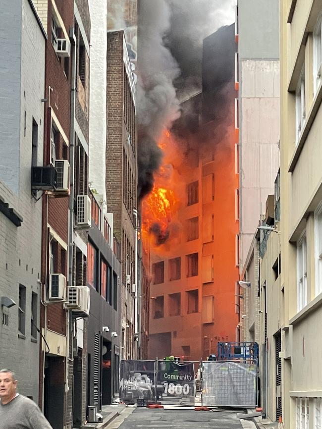 The building fire brought nearby streets to a standstill.