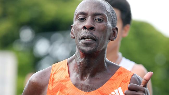 Kenneth Mungara gives the thumbs up on his way to winning the Gold Coast Marathon. Photo by Richard Gosling