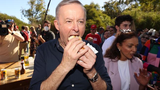 Mr Albanese broke a strict diet to tuck into the campaign staple. Picture: Liam Kidston