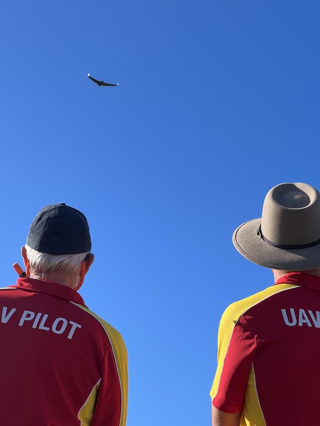 Lifesavers watch on as a drone takes to the sky.