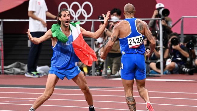 Italy's Lamont Marcell Jacobs, right, celebrates with high jumper Gianmarco Tamberi. Picture: AFP