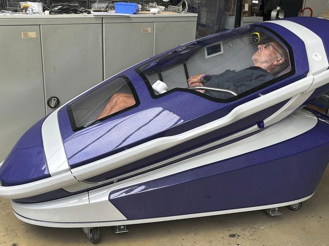 NETWORK SPECIAL. NO AUS, NO NEWS.COM , PLEASE CONTACT NETWORK PICTURE DESK BEFORE PUBLISHING.     ,  Philip Nitschke is seen inside a 'suicide pod' known as 'The Sarco' in Rotterdam, The Netherlands, July 8, 2024. (AP Photo/Ahmad Seir)