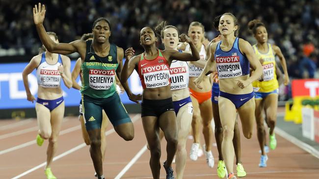 Kenya's Faith Kipyegon, centre, celebrates as she wins the gold medal in the final of the Woman's 1500m during the World Athletics Championships in London. Photo: AFP