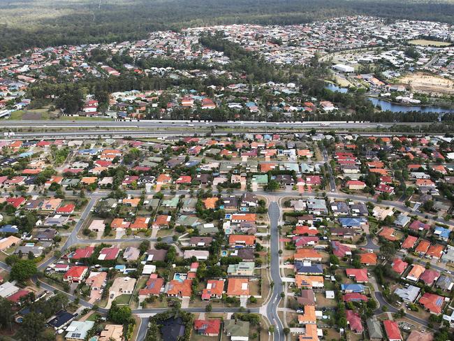 Aerial images of suburban house in South-West Brisbane. Generic houses, roof, solar panel, leafy suburb.