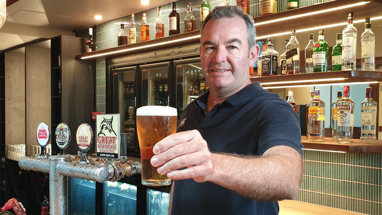 Duporth Tavern owner Clayton Williams pouring the first beer to celebrate the venue's $2.5 million revamp.