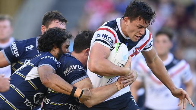 TOWNSVILLE, AUSTRALIA - JULY 17:  Joseph Manu of the Roosters is tackled during the round 18 NRL match between the North Queensland Cowboys and the Sydney Roosters at QCB Stadium, on July 17, 2021, in Townsville, Australia. (Photo by Ian Hitchcock/Getty Images)