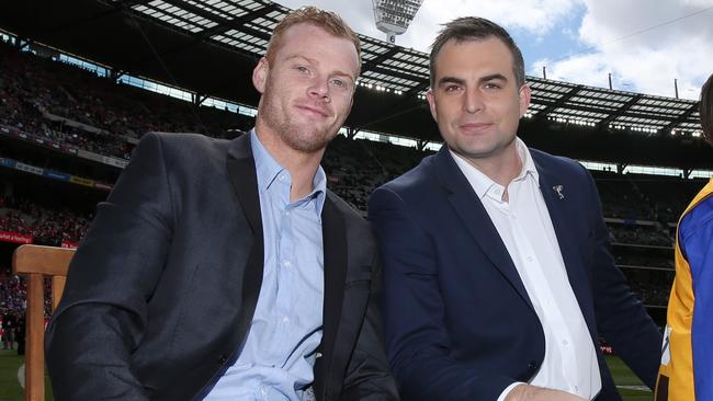 Lake and Cooney during the retiree’s lap of honour before the 2016 grand final. Picture: Michael Klein