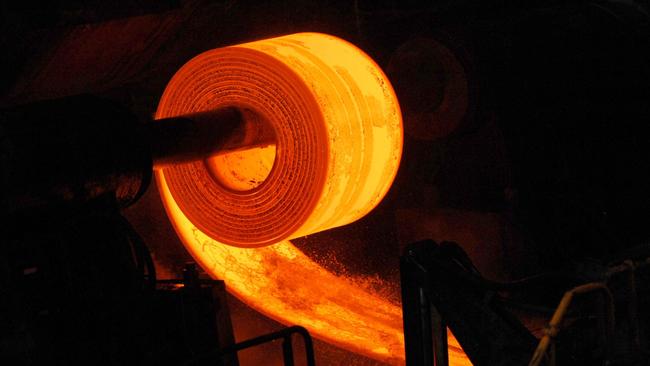 Hot roll coils are formed in the Hot Strip Mill during the manufacturing of steel at BlueScope Steel Ltd.'s Port Kembla Steelworks, in Port Kembla, outside Sydney, Australia, on Thursday, Sept. 17, 2009. BlueScope Steel Ltd. is Australia's largest steelmaker. Photographer: Jeremy Piper/Bloomberg