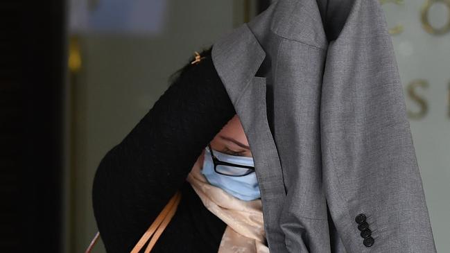 A camera shy Costigan outside Sydney’s Downing Centre on Monday. Picture: NCA NewsWire/Joel Carrett