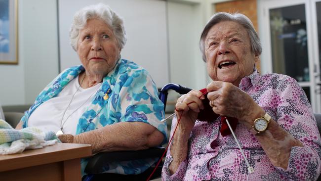 Best friends, and residents, Joan Somerville and Joan Henderson of Allambie Heights Village aged care facility share a joke at their knitting group. Picture: Nikki Short