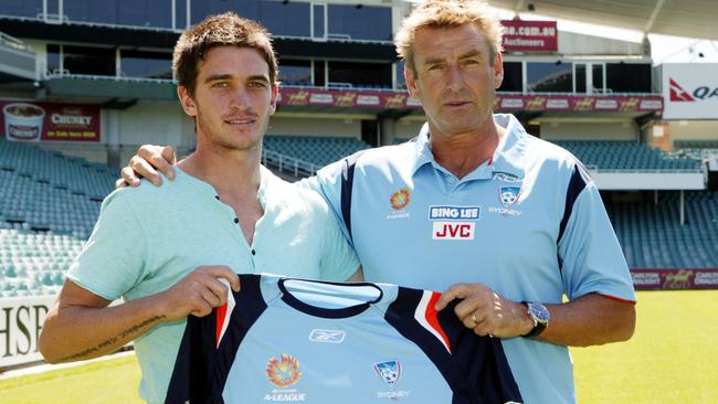 Stuart Musialik after signing with Sydney FC with then-coach John Kosmina. 