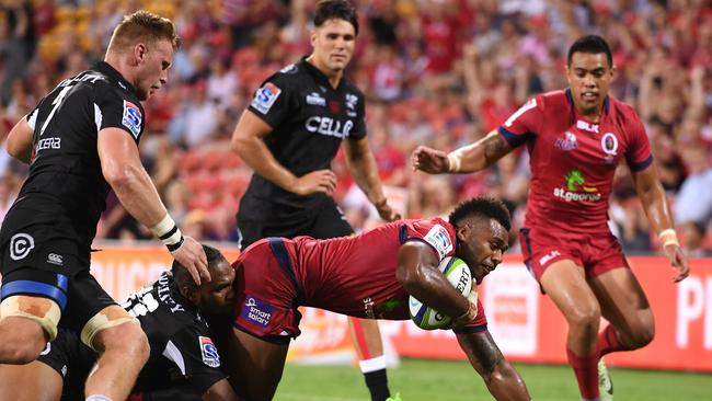 Reds player Samu Kerevi crosses over to score a try.