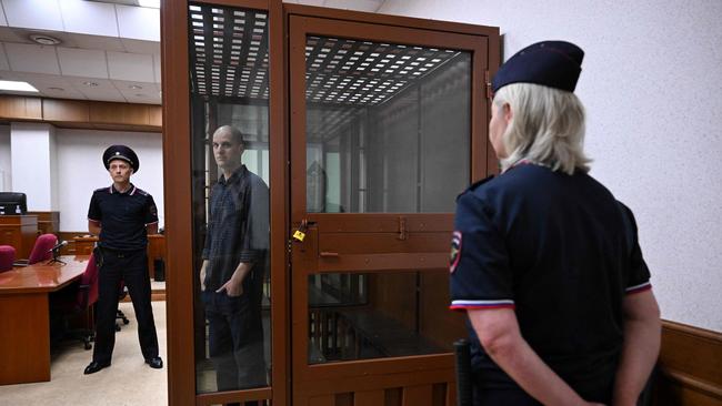 US journalist Evan Gershkovich looking out from inside a glass defendants' cage prior to the hearing. Picture: Natalia Kolesnikova/AFP