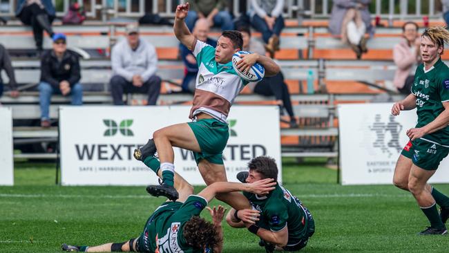 Zac Crowley busts through a tackle.