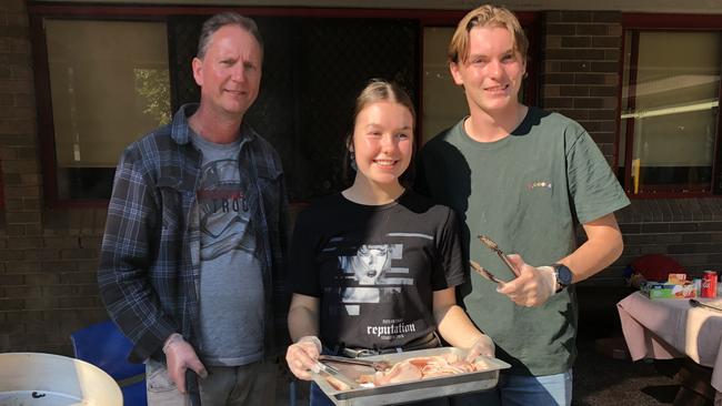 Parent Glenn Pritchard and students help out with the sausage sizzle at Holsworthy High School on election day.