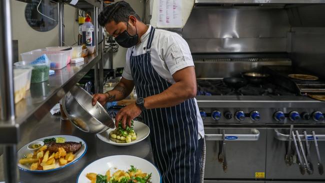 Hospitality workers have to be double-vaccinated. Photo by Getty Images