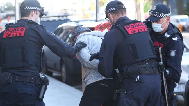 Police make an arrest in the Melbourne CBD. Picture: David Crosling