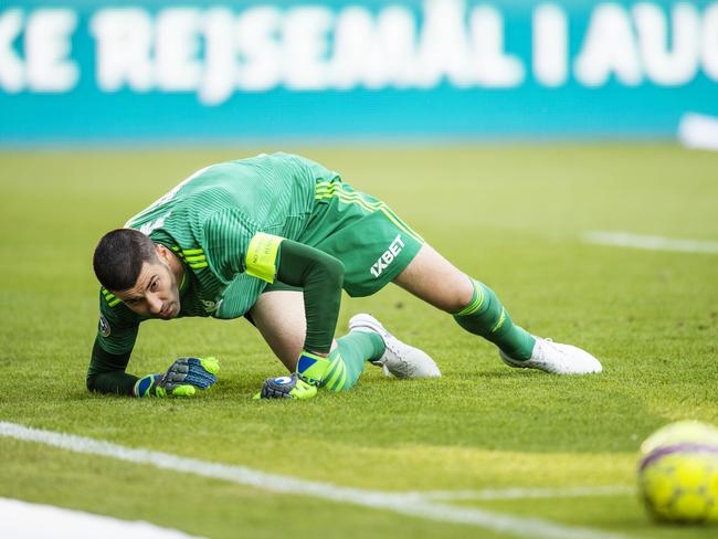 Goalkeeper Nenad Eric looks at the ball during UEFA Champions League, Second Qualifying Round between FC Midtjylland and FC Astana, Wednesday, Aug. 1, 2018 in Herning, Denmark. (Bo Amstrup / Ritzau Scanpix via AP)