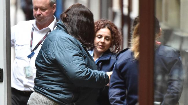 Katia Pyliotis (centre left) has had her conviction overturned. Picture: James Ross/AAP