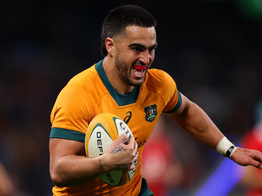 Tom Wright on his way to the try line after a piece of individual brilliance to seal victory for the Wallabies. Picture: Jason McCawley/Getty Images