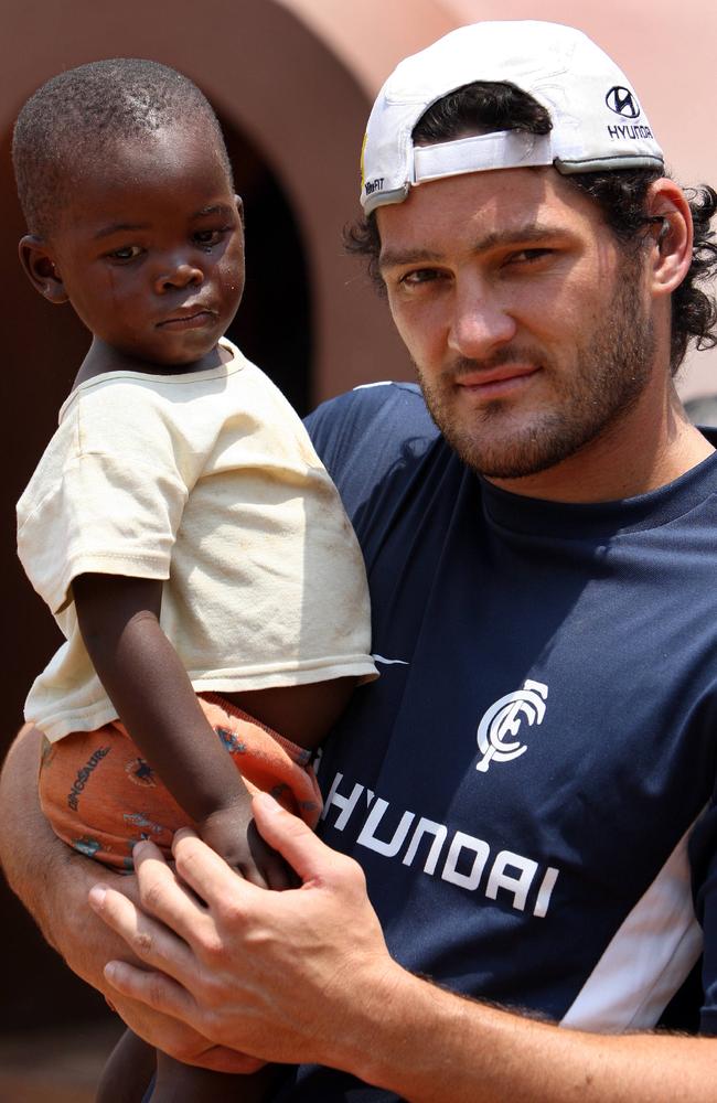 Carlton players including Brendan Fevola visited the Sparrow HIV Village in Johannesburg.