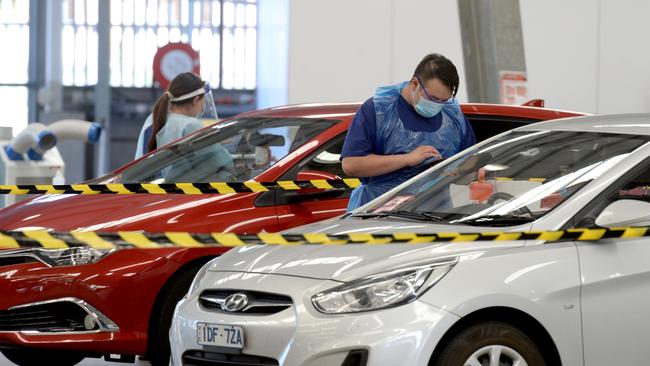 People get tested for coronavirus at the Melbourne Showgrounds site. Picture: NCA NewsWire/Andrew Henshaw