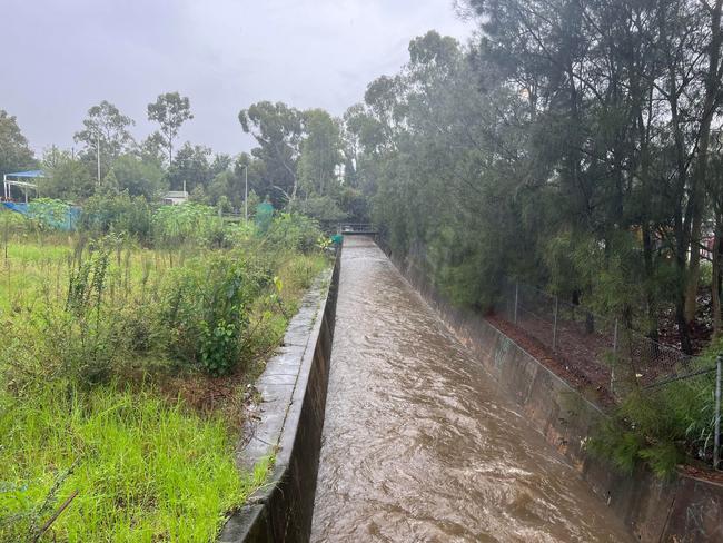 The bodies of a man and woman, have been found during a search for a missing mother and son after their car was abandoned in a Wentworthville stormwater canal. Picture: David Meadows